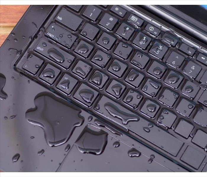 The keyboard of a computer with water